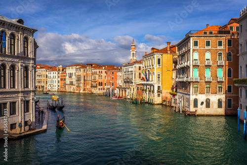 Rialto bridge in Venice  Italy. Venice Grand Canal. Architecture and landmarks of Venice. Venice postcard with Venice gondolas