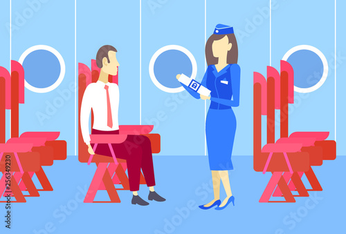 stewardess presenting to business man airplane passenger seat belt fastening explains safety concept modern plane board interior full length horizontal
