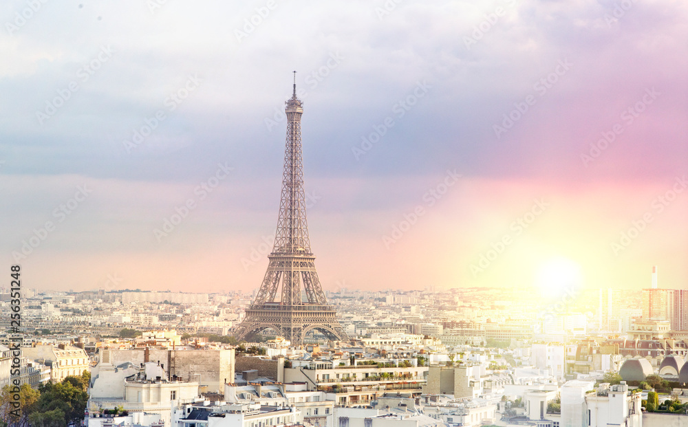 Fototapeta premium Sunset Eiffel tower and Paris city view form Triumph Arc. Eiffel Tower from Champ de Mars, Paris, France. Beautiful Romantic background.