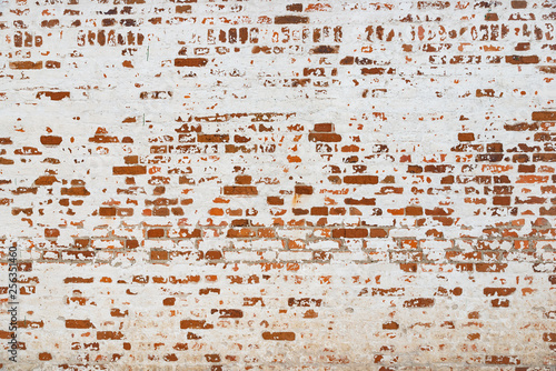 Obraz na płótnie The texture of the old brick wall painted white with peeling paint w salonie
