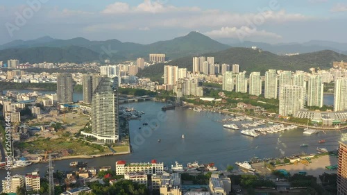 sunny evening sanya city harbour bay riverside aerial panorama 4k hainan china photo