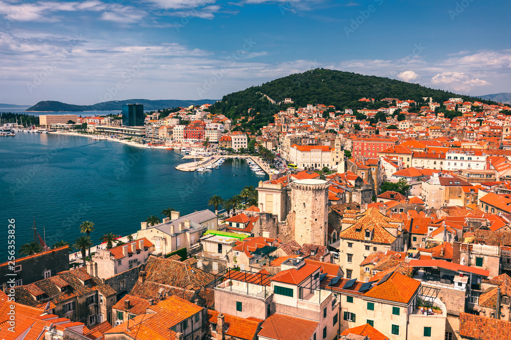 Split waterfront and Marjan hill aerial view, Dalmatia, Croatia. Panoramic summer cityscape of old medieval city Split, Croatia, Europe.  Traveling concept background.
