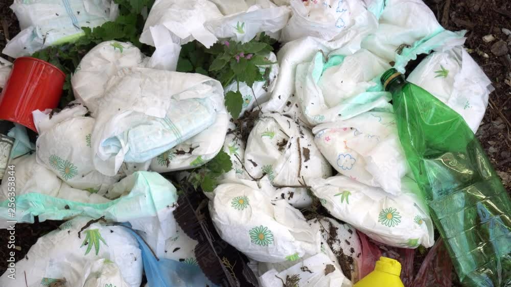 Disposable diaper waste in landfill. Environmental pollution Stock ビデオ