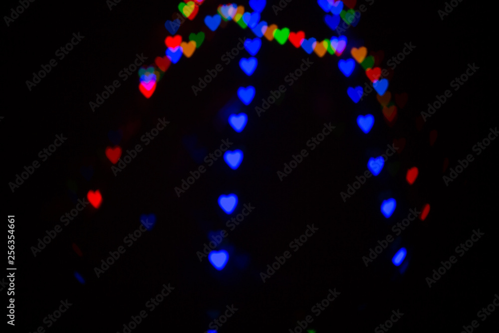 Colorful abstract heart shape blured bokeh at night