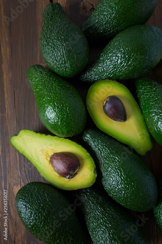 avocado on dark wooden surface