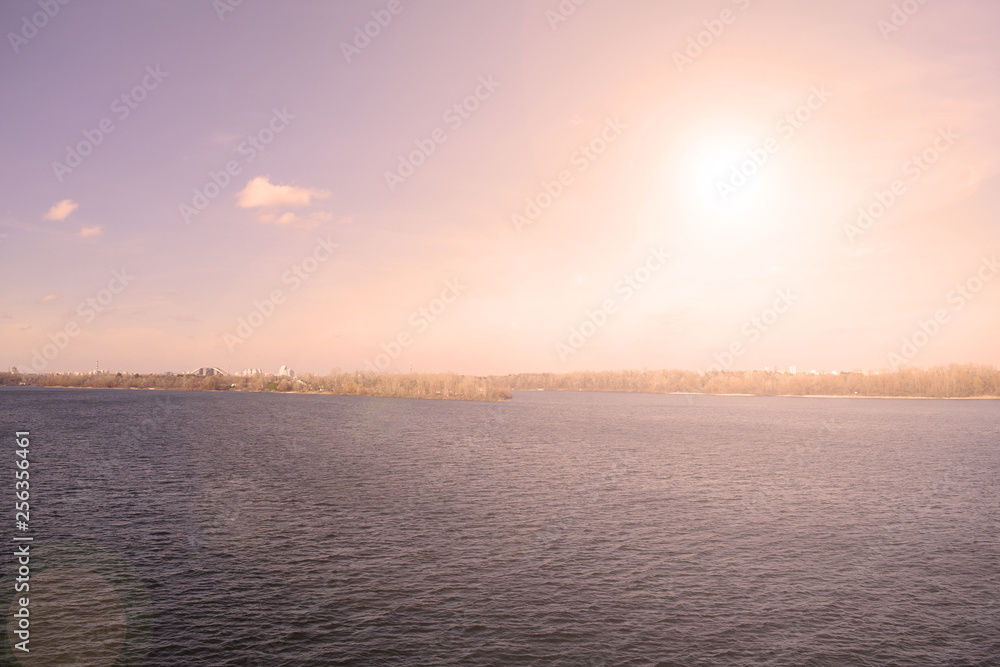 Sunset over the river in the city. The landscape is beautiful. Sunset over the river in the city. The landscape is beautiful.