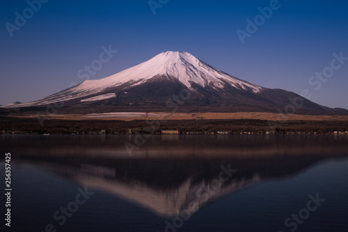 Mt.Fuji and the water reflection at Lake Yamanaka during the winter © torsakarin
