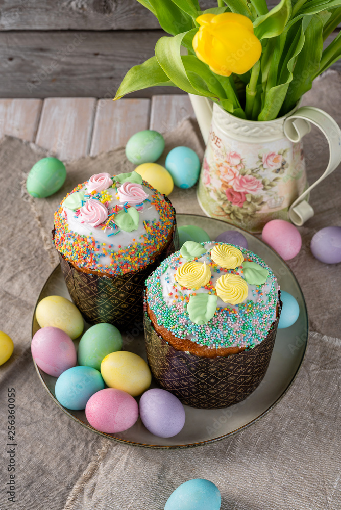 Easter cake, painted eggs on a wooden background. Easter cake, painted eggs on a wooden background.