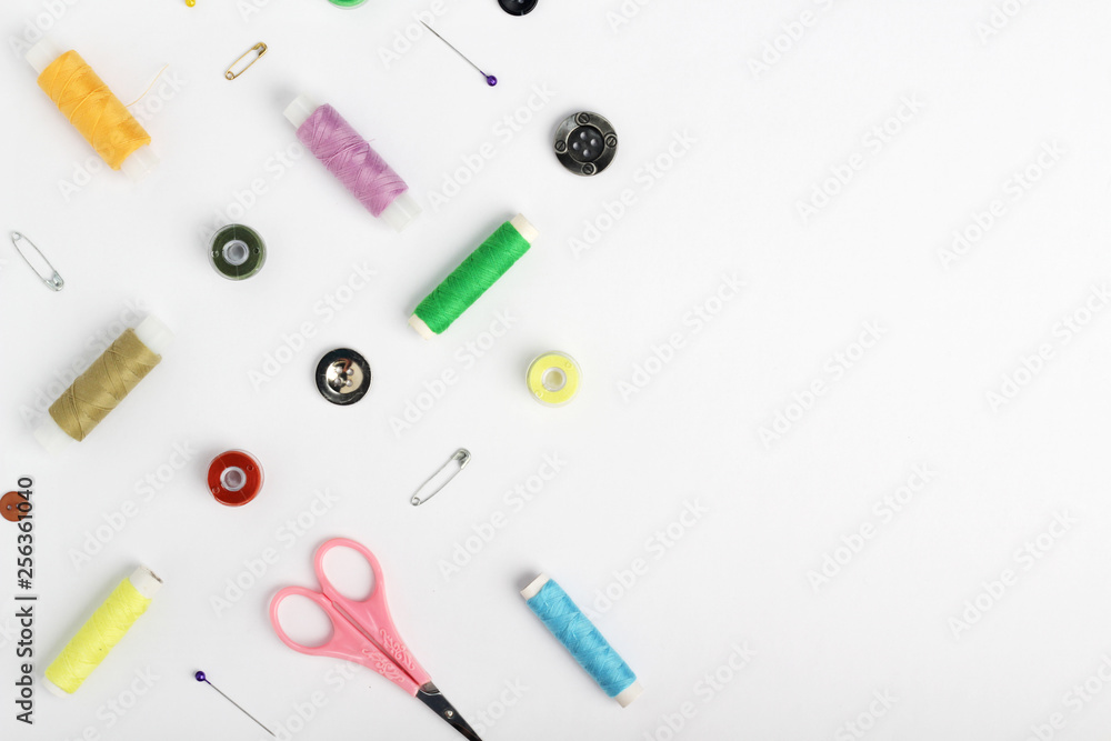 White background with different tools for sewing and tailoring White background with different tools for sewing and tailoring