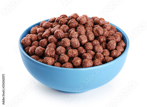 Fotografie Bowl with chocolate corn balls isolated on white background.
