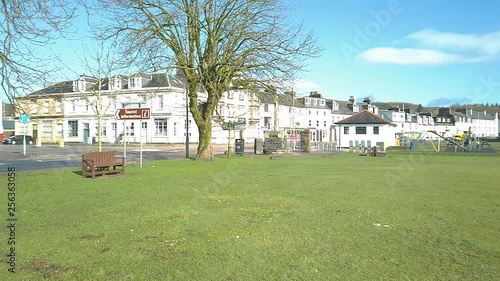 Central street,  playground with baby and mom on it. photo