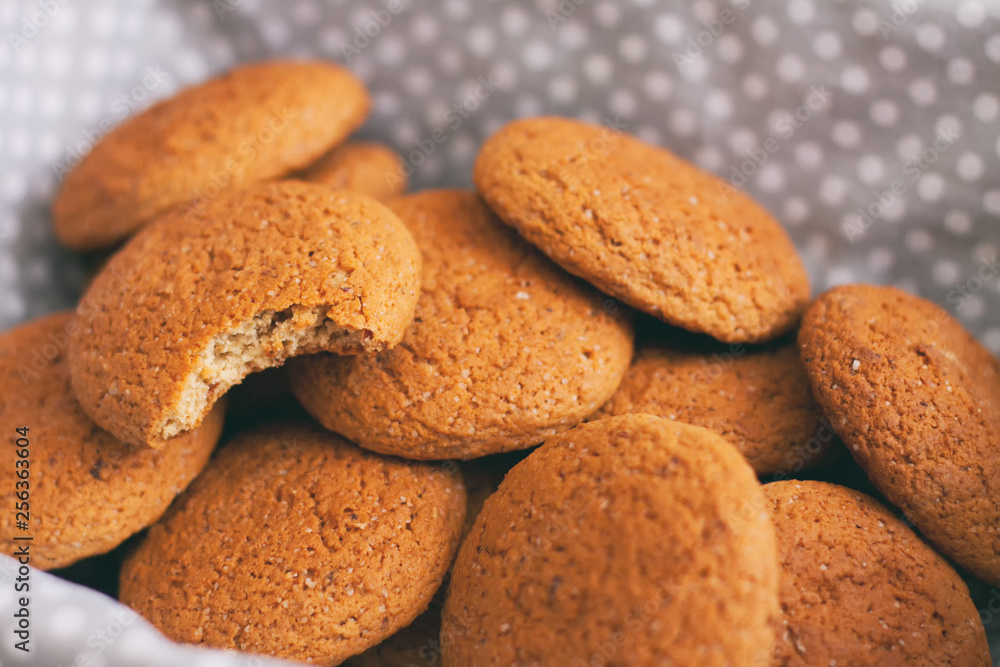 Fresh oatmeal cookies on light-colored fabric Fresh oatmeal cookies on light-colored fabric