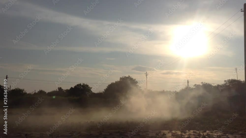 Dense Smoke from burning grass in the garden in the village and Sun 3 Dense Smoke from burning grass in the garden in the village and Sun 3