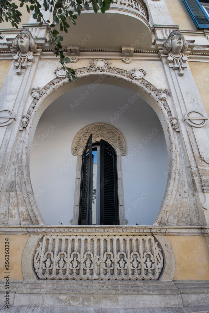 Lecce, Puglia, Italy - Baroque house and historical center in the old town. View and detail of an statues and facade of houses. A region of Apulia