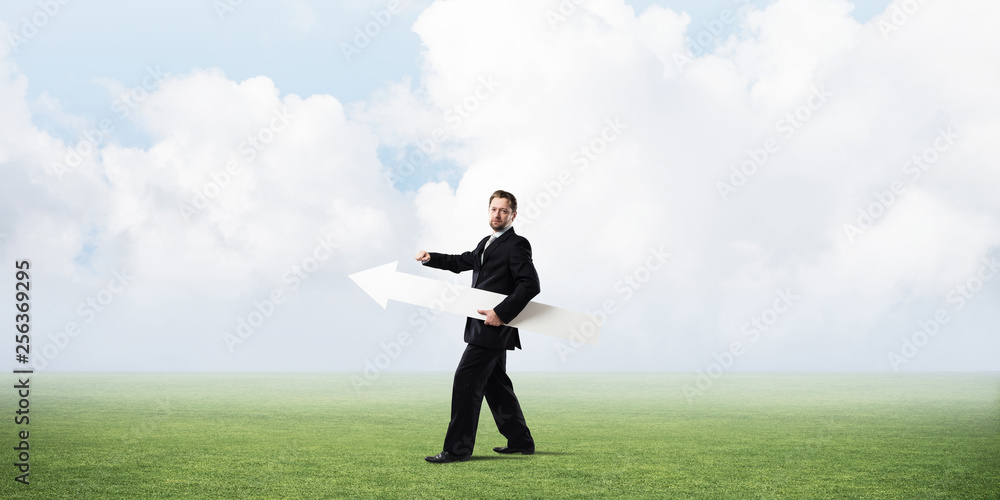 Conceptual image of businessman pointing aside Conceptual image of businessman pointing aside