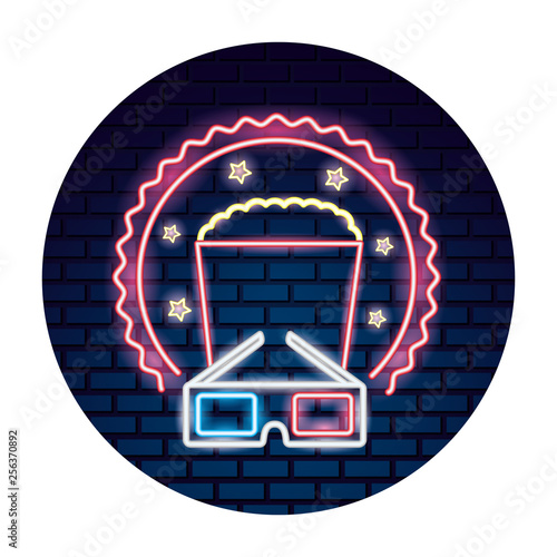 cinema glasses and popcorn with light of neon