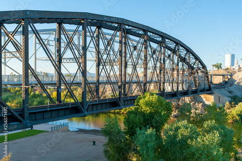 Historic Ocean-to-ocean truss bridge over Colorado river at Yuma Crossing, Arizona #256371492