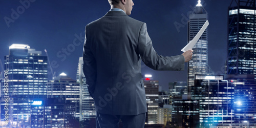 Digital background with infographs and man extending papers or contract