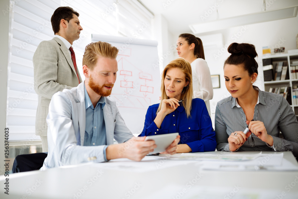 Group of business people working as team in office Group of business people working as team in office