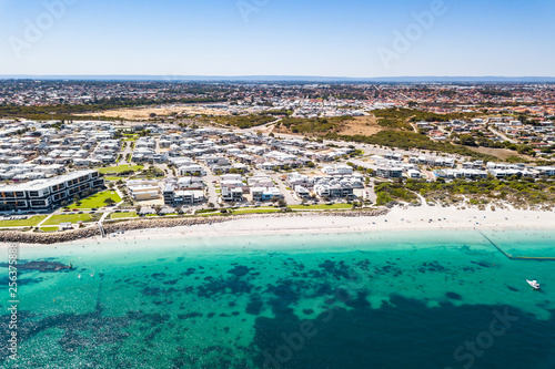 Aerial / drone photo over Coogee Beach and the marina at Port Coogee, Fremantle, Western Australia, Australia.