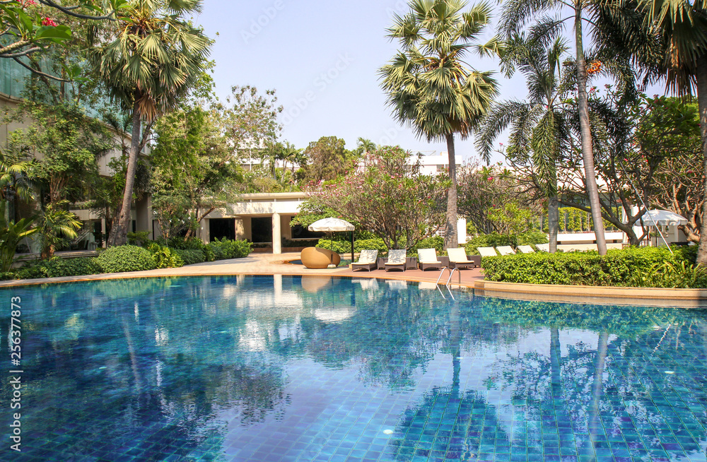 Beautiful luxury swimming pool in tropical hotel pool resort