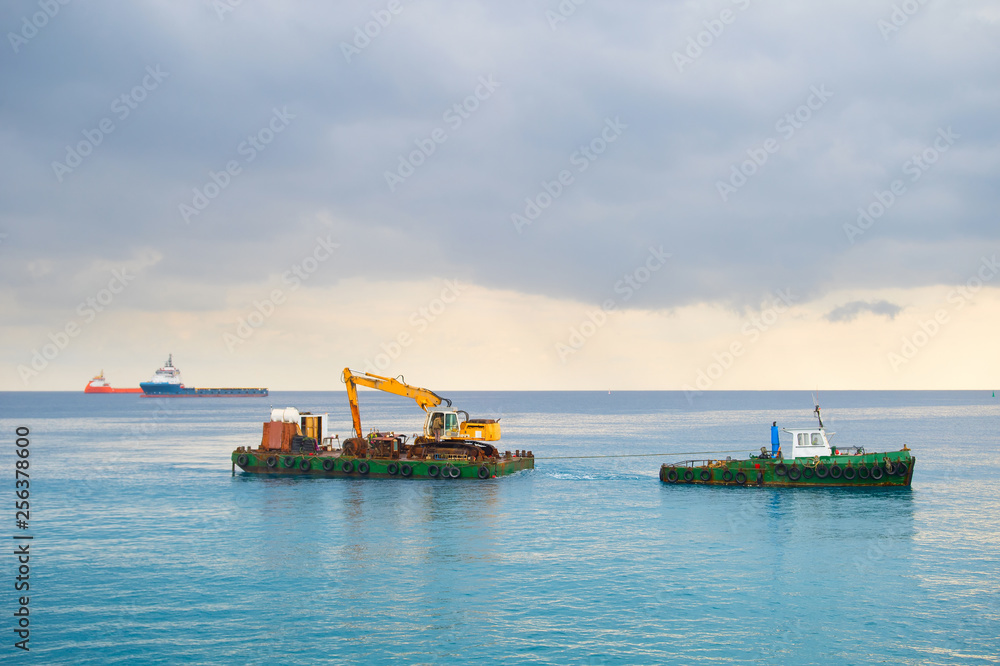 Industrial tug carrying boat sea Industrial tug carrying boat sea
