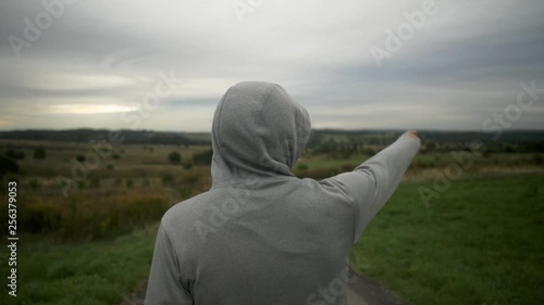 Men is looking on valley. Med shot, slow motion 50fps photo