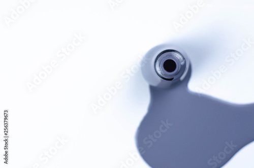 A jar of spilled varnish gray color on a white background. photo