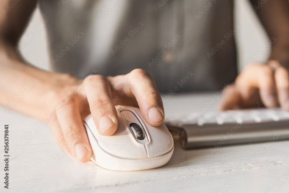 Men typing on computer keyboard and using mouse. Businessman using laptop in the office. Online internet marketing concept. Freelance work Men typing on computer keyboard and using mouse. Businessman using laptop in the office. Online internet marketing concept. Freelance work