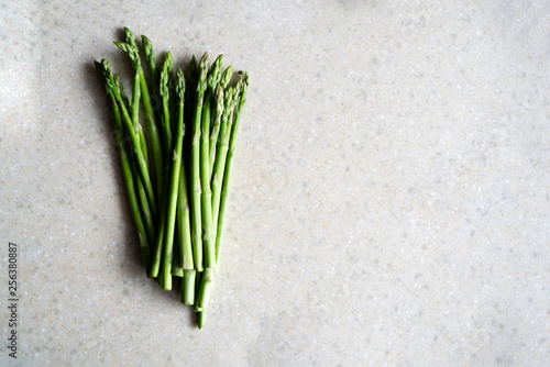 bunch of fresh asparagus on wooden table