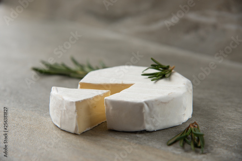 Cheese camembert or brie with fresh rosemary