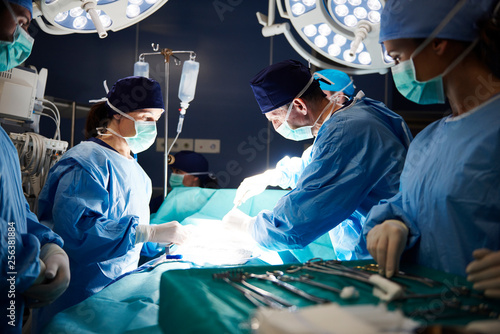 Busy surgeons during difficult operation photo