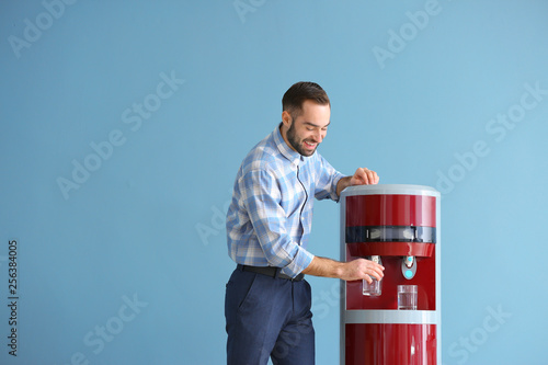 Man pouring water from cool...