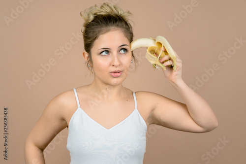 Wallpaper Mural cute girl with a banana Torontodigital.ca