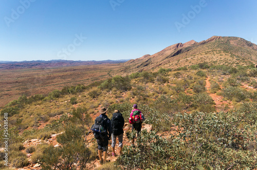 a group of Hikers on the way to the top of Mount Sonder just outside Alice Springs, West MacDonnel National Park, Australia