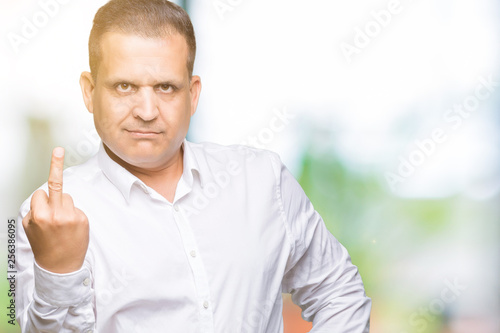 Middle age arab elegant man over isolated background Showing middle finger, impolite and rude fuck off expression