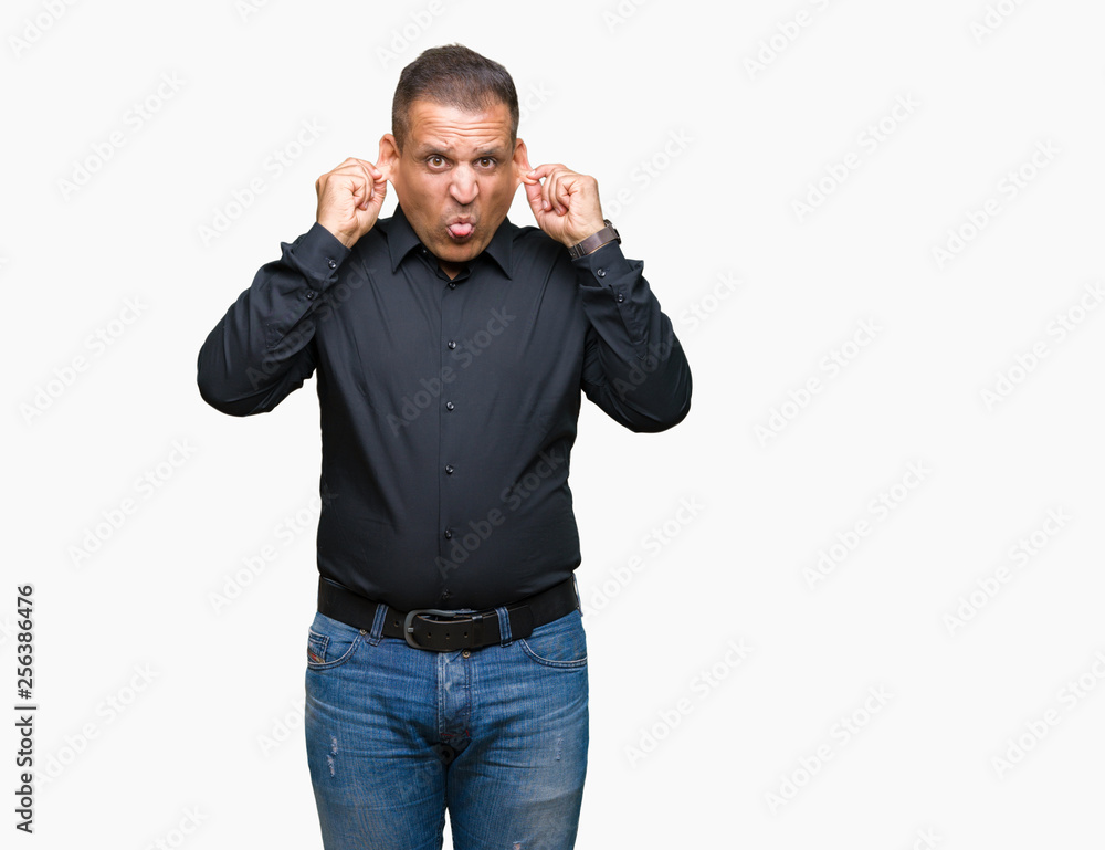 Handsome middle age arab business man over isolated background covering ears with fingers with annoyed expression for the noise of loud music. Deaf concept. Handsome middle age arab business man over isolated background covering ears with fingers with annoyed expression for the noise of loud music. Deaf concept.