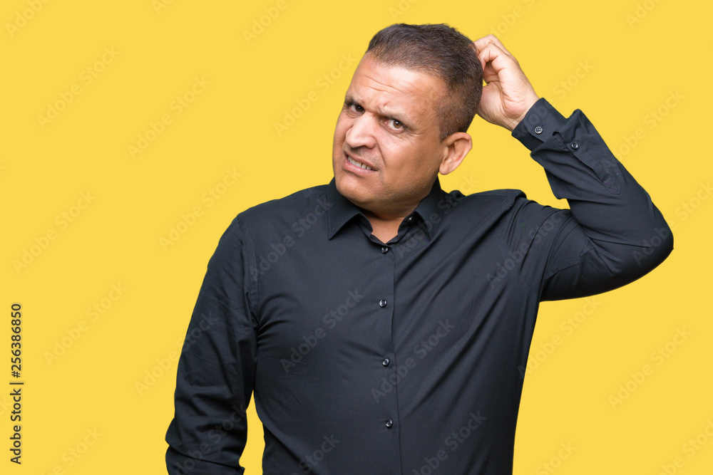 Handsome middle age arab business man over isolated background confuse and wonder about question. Uncertain with doubt, thinking with hand on head. Pensive concept. Handsome middle age arab business man over isolated background confuse and wonder about question. Uncertain with doubt, thinking with hand on head. Pensive concept.
