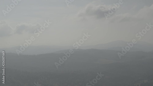 Wallpaper Mural Aerial drone view over the forested polish mountains valley. Forested mountains stretch into the distance in the fog Torontodigital.ca