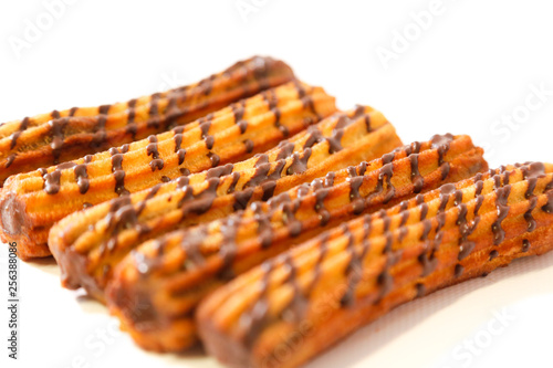 spanish chocolate fritters with white background