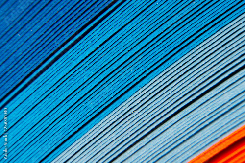 Colored paper strips as a colorful background. The colored paper on a background.