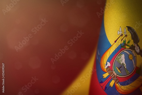 Ecuador flag for honour of veterans day or memorial day. Glory to the Ecuador heroes of war concept on red dark velvet background.