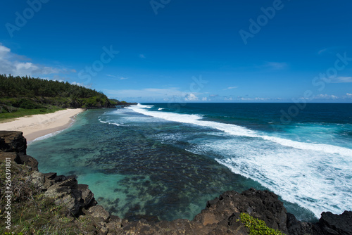 Ocean waves crashing tropical island beach