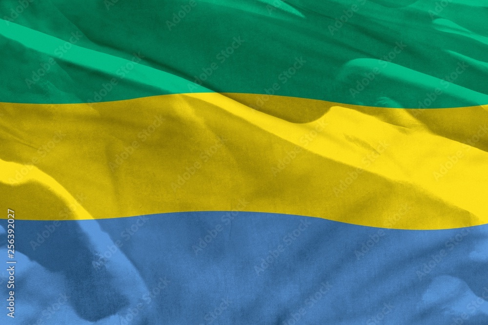 Waving Gabon flag for using as texture or background, the flag is fluttering on the wind Waving Gabon flag for using as texture or background, the flag is fluttering on the wind