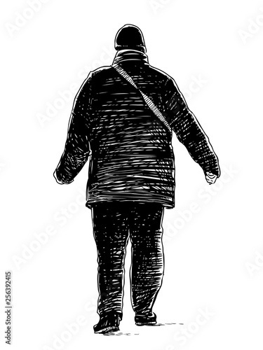 A casual townsman walking down the street