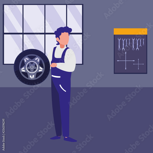 mechanic worker with tire car