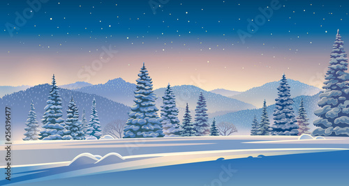Winter evening landscape with mountains and snow-covered trees in the foreground.