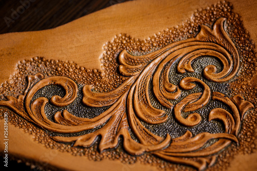 embossed pattern on the leather in the workshop