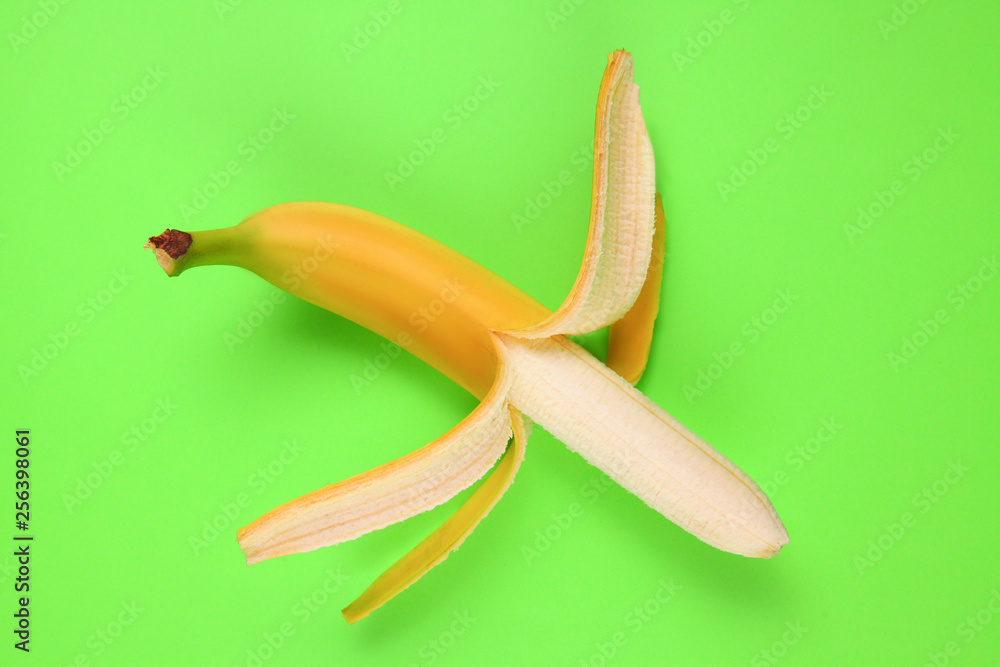 open banana on bright background. Copy space