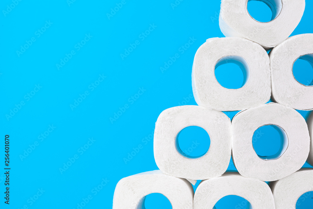 Toilet paper. Close up shot on blue background Toilet paper. Close up shot on blue background
